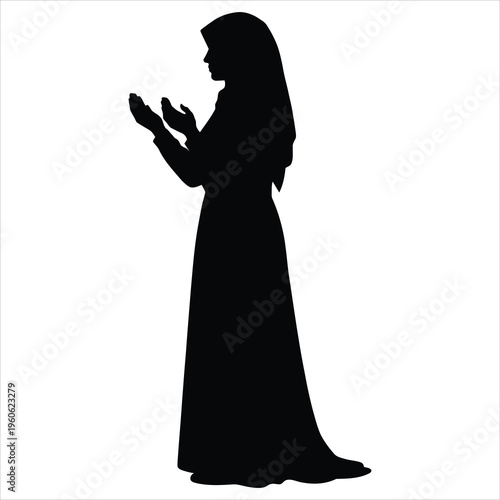 A woman in a long dress is praying