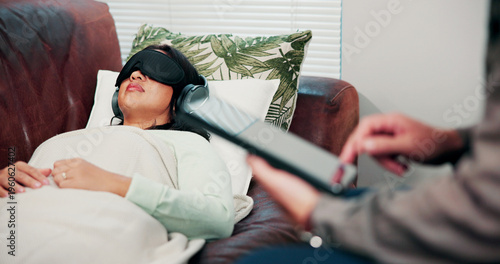 Quadro su tela Psychology, treatment and woman on sofa with headphones, relax or psychedelic counseling