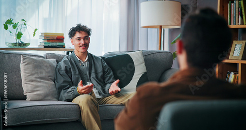 Photos Talking, sofa and man with psychologist in office for advice, help or life coaching session