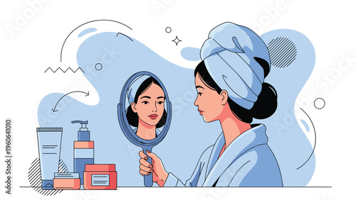 Young woman wearing a towel on her head carefully looks in a mirror and inspects her skin while surrounded by beauty products.