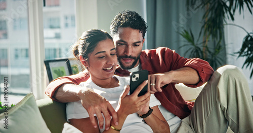 Tableau sur toile Relax, talking and couple on sofa with phone for social media, networking and bonding on weekend