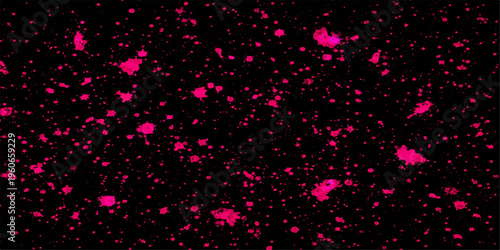 Abstract crimson paint splatters dance across a deep black canvas, creating a vibrant display. 
