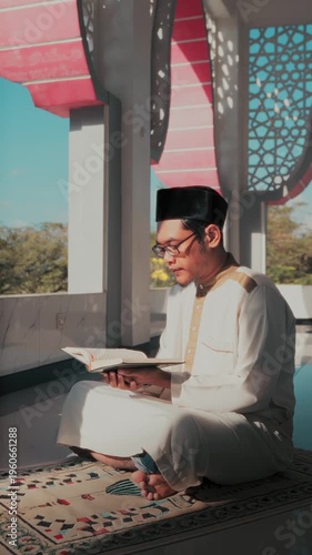 A Muslim man performing Islamic pray inside a mosque during Ramadan, a peaceful spiritual moment with beautiful mosque architecture.
