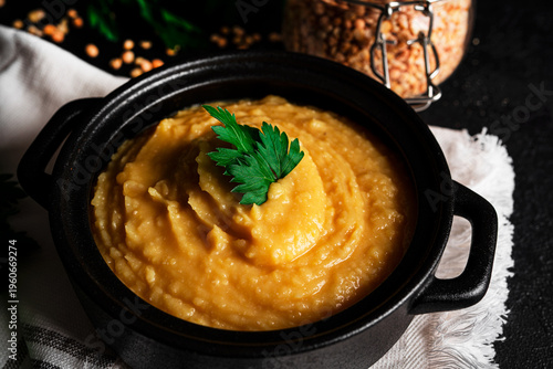 Pea puree on a dark background. Mushy peas. Pease pudding. Pea porridge. High quality photo