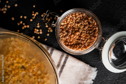 Bowl of yellow dried split peas on dark background. Yellow soaked peas. High quality photo
