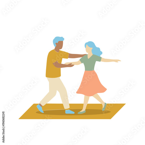 Man and woman dancing together on yellow mat in studio