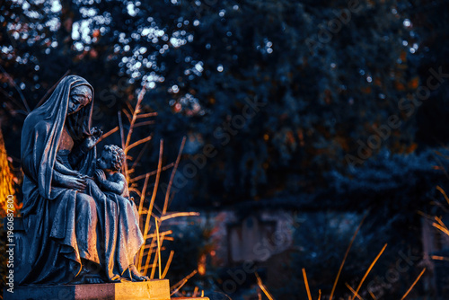 Mother Mary And Child Statue In Moonlight