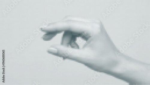 Closeup of a hand making a pinching gesture against a light background