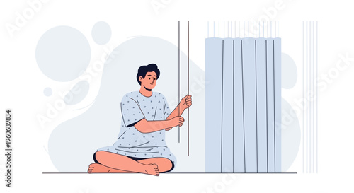 Patient in hospital gown sitting on floor, pulling curtain cord, isolation concept