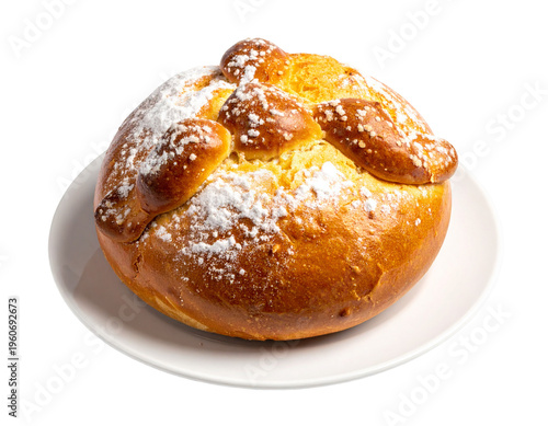 Sweet roll bursting with powdered sugar and golden brown crust, atop a white plate