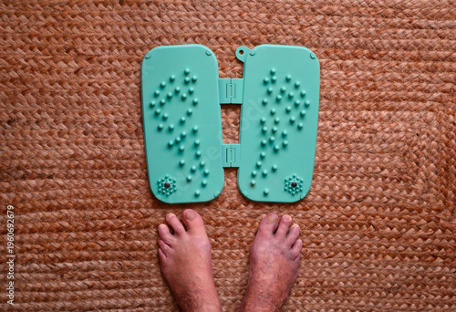 Foot massager designed specifically for massaging the key active reflex points of the feet and used to relieve varicose veins and leg swelling

