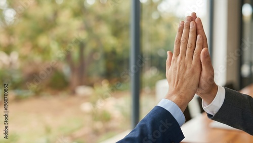 Hands Engaging in a Gesture of Collaboration with a Natural Background