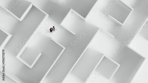 Top view of white maze with two people discussing path representing teamwork and planning. Concept of collaborative decision making, strategic discussion process, problem solving workflow.