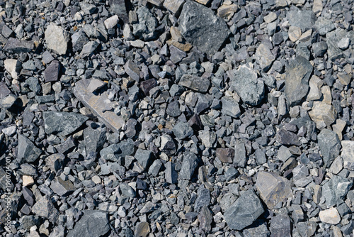 Canvas Print Crushed rock covering ground surface at construction site, gold mining tailings impoundment