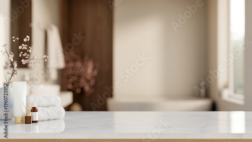 Fotografía White towel with diffuser and skincare on shiny marble counter table across tub