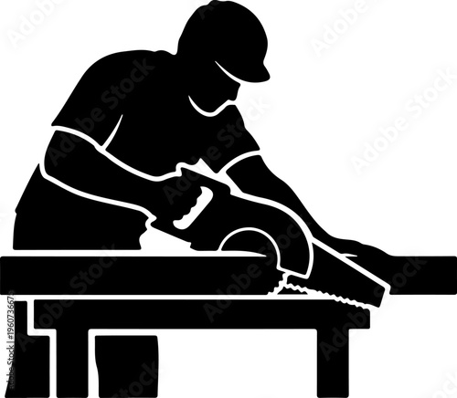 A worker in a hat cuts wood with a power saw on a table.
