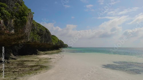 Rising tide water covering sandy mtende beach in zanzibar