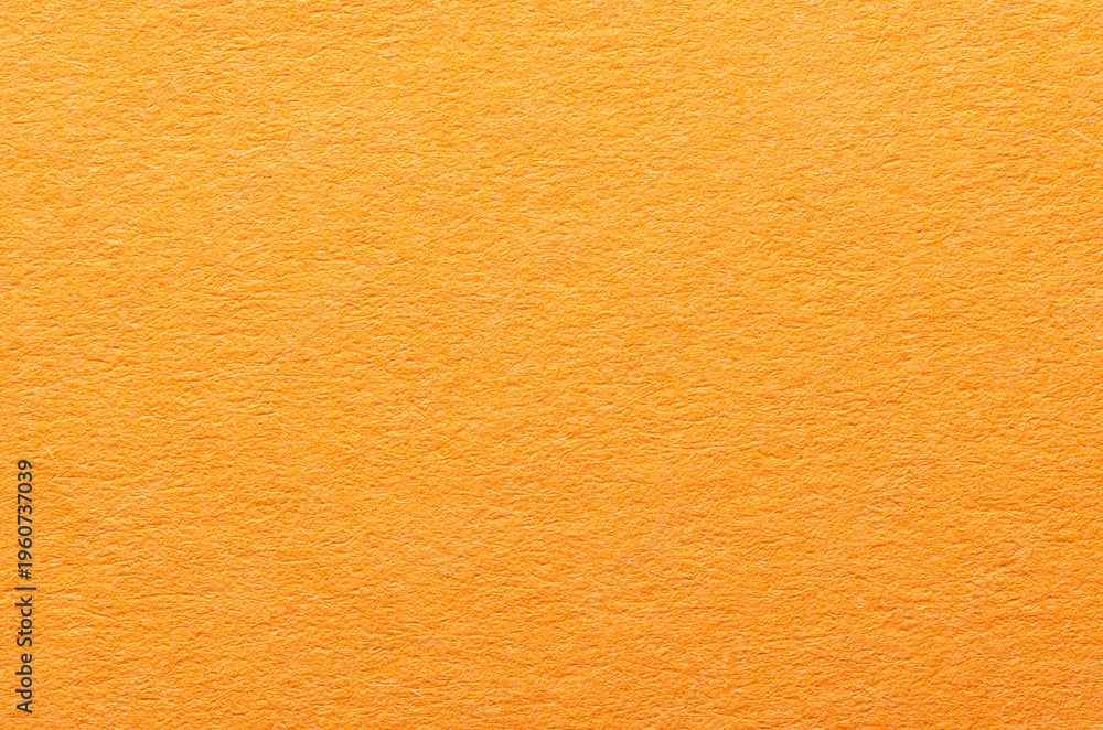 Fototapeta premium Orange paper background or backdrop with fine details and smooth texture with copy space for text design element