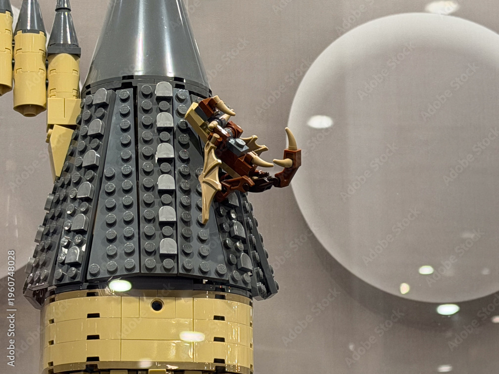 Obraz premium Lego castle tower with dragon climbing the roof