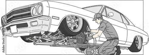 Mechanic changing car tire in garage