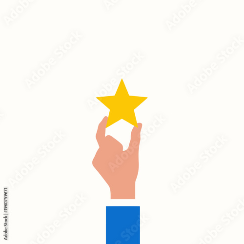 A hand holding up a gold star isolated on white