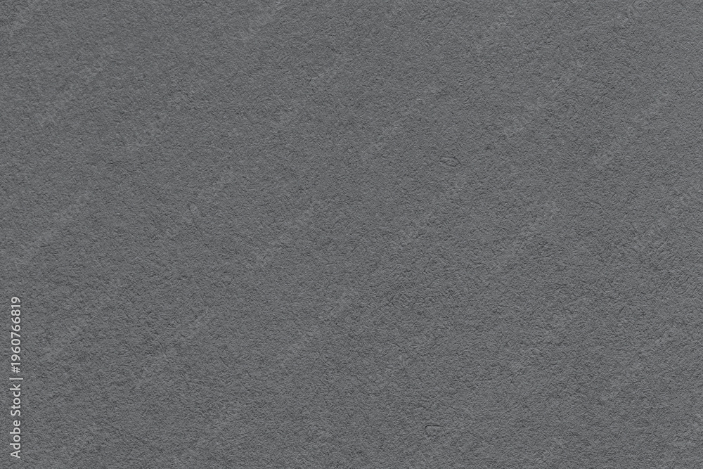 Fototapeta premium Dark gray textured paper background with subtle grain surface and soft structure. Graphite backdrop, macro