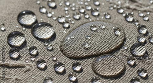Water drops on fabric surface closeup.