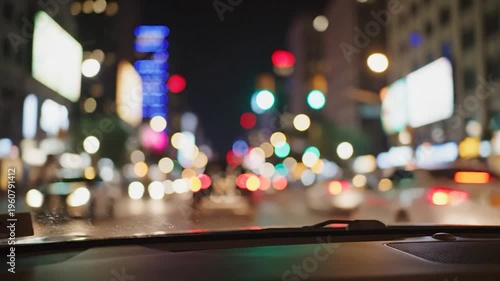 Blurred city lights seen from inside a vehicle at night