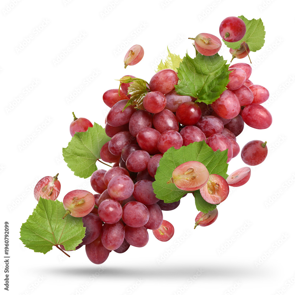 Obraz premium Fresh juicy grapes and green leaves falling against white background