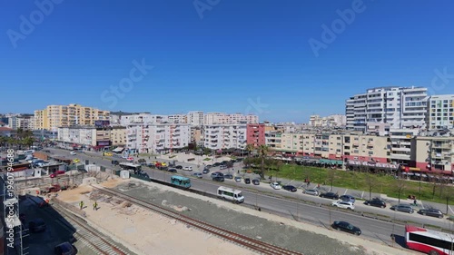 Busy traffic near railway station construction in Durres