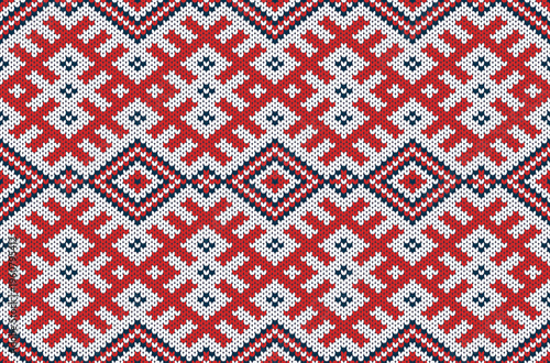 Native American style cross-stitch pattern in red tones.