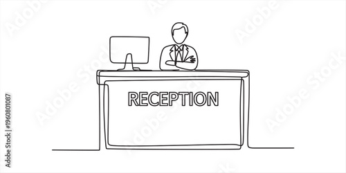 receptionist at front desk with computer