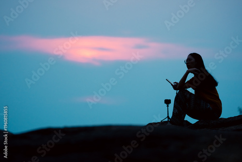 Silhouette woman smartphone...