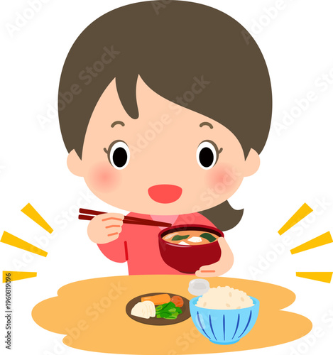 ご飯と漬物と味噌汁の食事を摂る女性