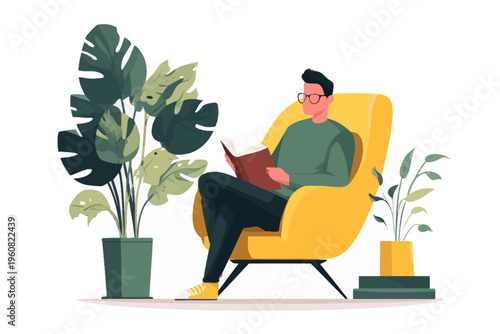 Young caucasian male relaxing in yellow chair while reading book surrounded by indoor plants
