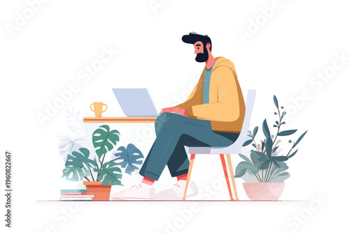 Young caucasian male working on laptop surrounded by houseplants and coffee cup