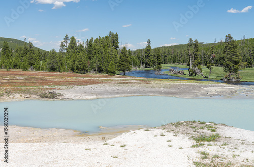 Wallpaper Mural Geothermal pool in Biscuit Basin with The Firehole River in the background, Yellowstone Park. Wyoming, USA Torontodigital.ca