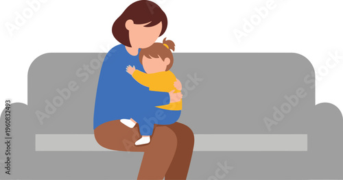 Mother securely holds a small child embracing her tightly while they sit together on a plain gray sofa.