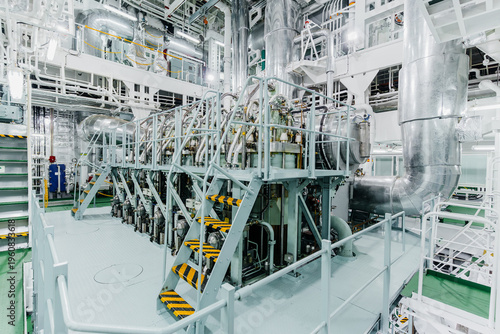 Schilderij op canvas High angle interior view of a massive marine diesel engine inside a ship engine