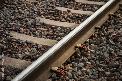 View of railway track over stone pile