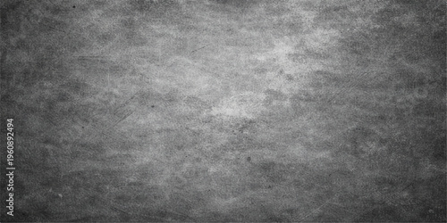 A dark and weathered grunge metal texture with a rough gray concrete wall pattern creates a vintage black stone backdrop on an old dirty surface
