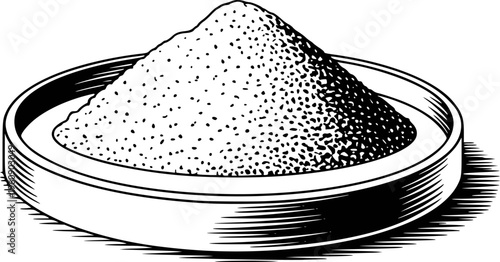 Black and white of a pile of granular in a shallow dish
