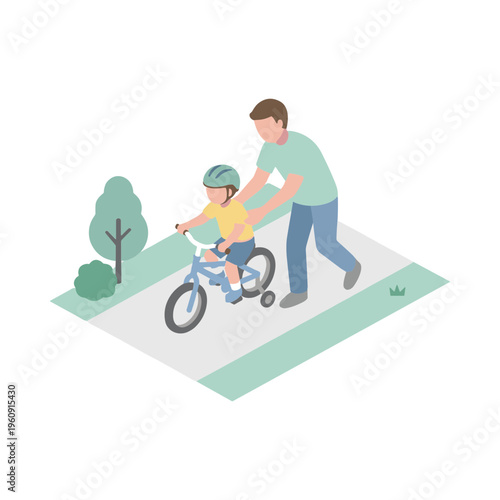 Father teaching young boy riding bicycle on path in park outdoors