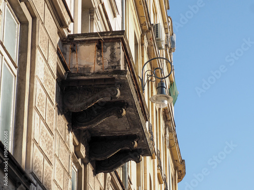 Close up of a vintage ornate stone balcony on a historic European apartment building