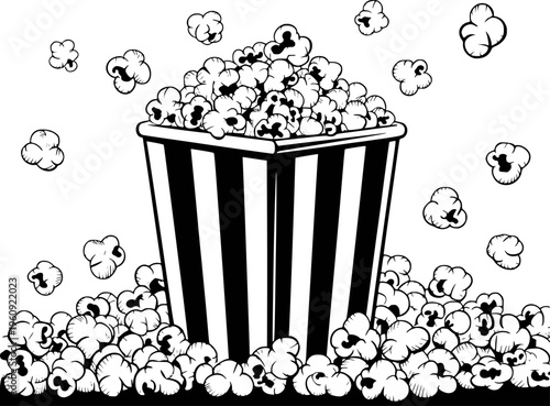 Black and white of a striped popcorn bucket overflowing with kernels and scattered popcorn pieces