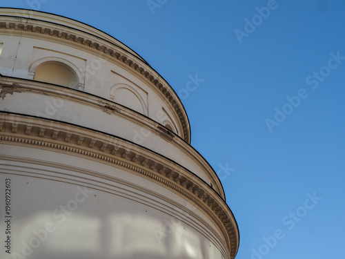 Architectural detail of the white neoclassical rotunda facade against a clear blue sky