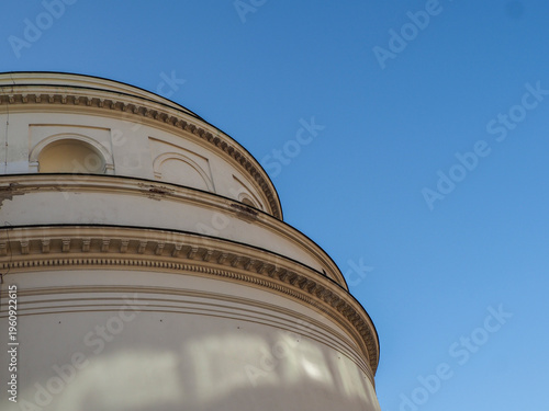 Low angle shot of a white neoclassical building wall with architectural shadows