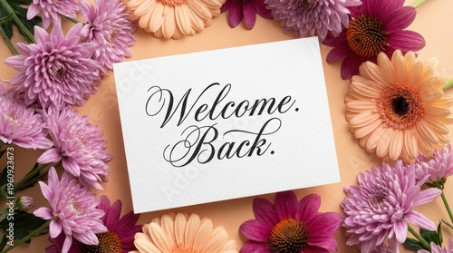 Colorful Floral Arrangement Surrounding Handwritten Welcome Back Card on Soft Background