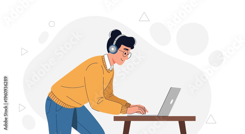 Young man with headphones working on a laptop, focused and productive
