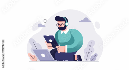 Bearded man with headphones works on laptop and tablet